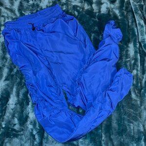 Blue pants. Fringed on the sides of each leg.